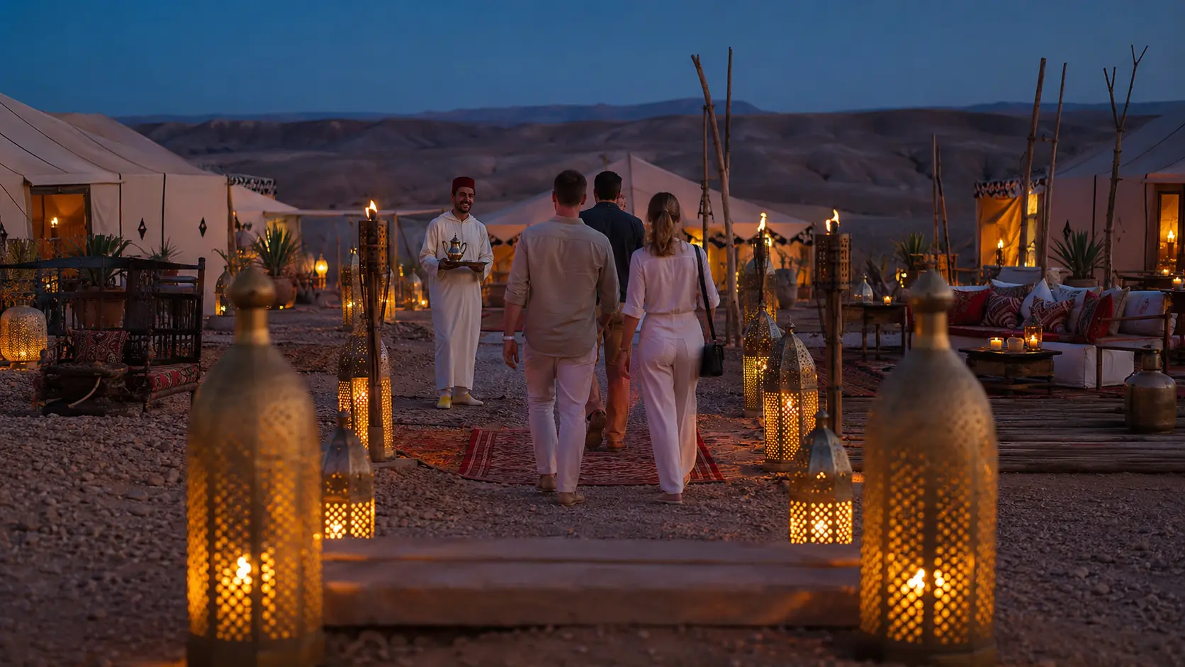 Warm lantern-lit Moroccan desert camp at dusk